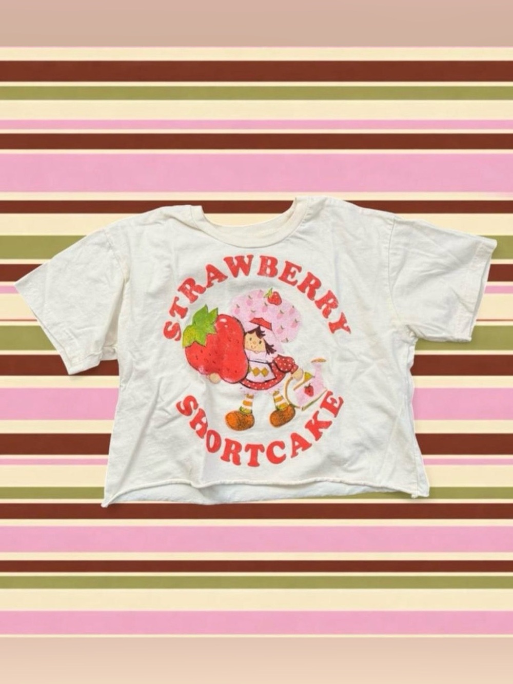 Strawberry Shortcake cropped cotton tee with graphic of a girl with a strawberry